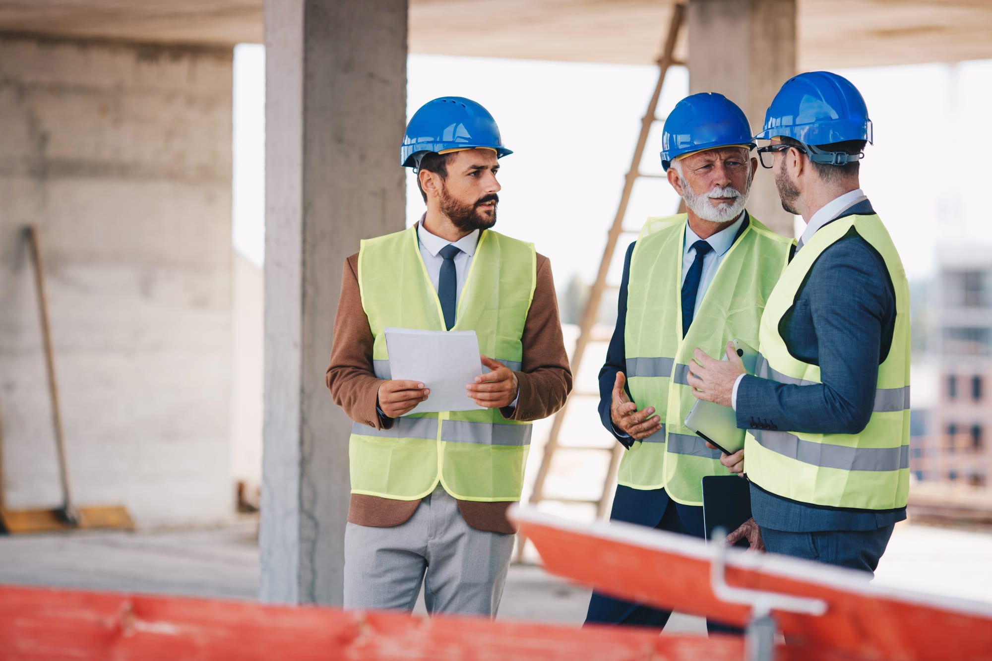 Site managers reviewing work on a job site